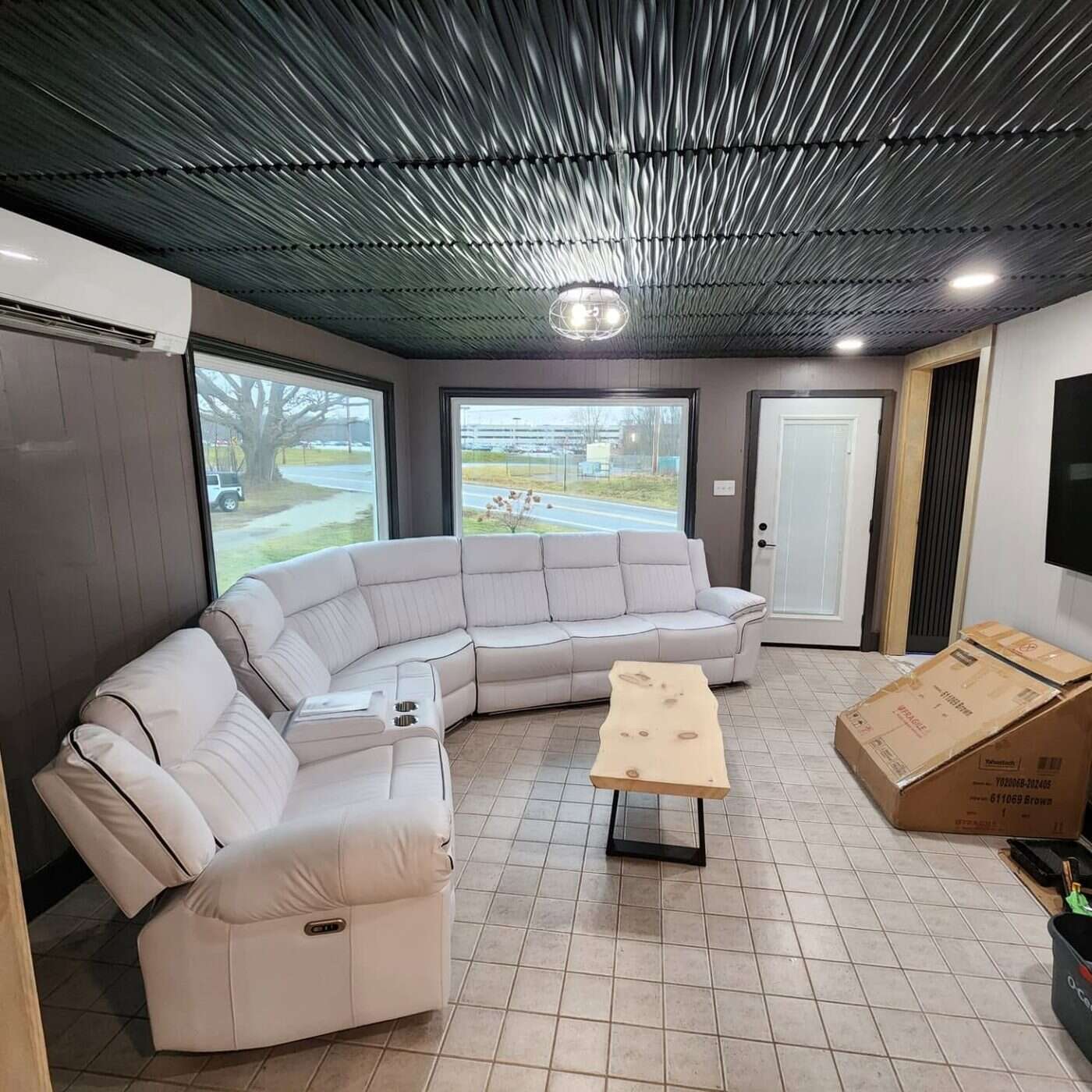 Living room with marble-look porcelain tile flooring