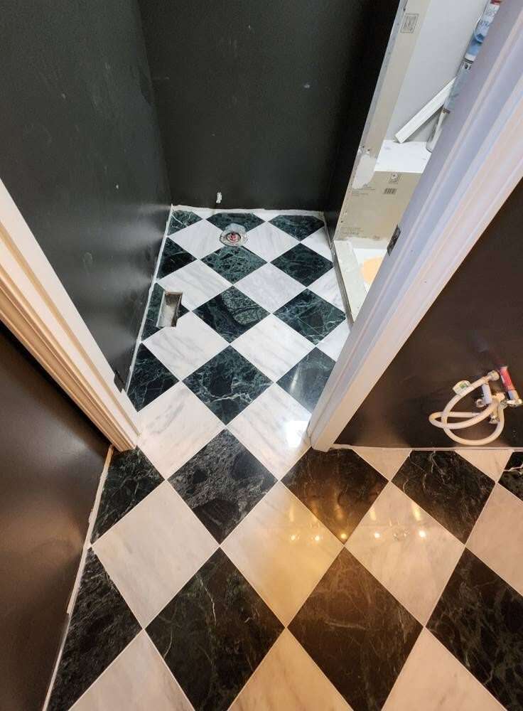 Bathroom after remodel with glass shower door